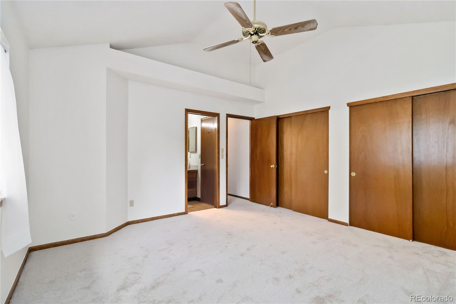 2136 South Scranton Way Aurora, CO 80014 - Photo 12 of 22 a view of a livingroom with a chandelier fan