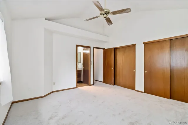 a view of a livingroom with a chandelier fan