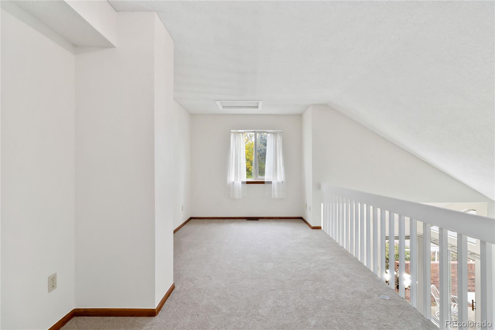2136 South Scranton Way Aurora, CO 80014 - Photo 14 of 22 a view of an empty room with a window