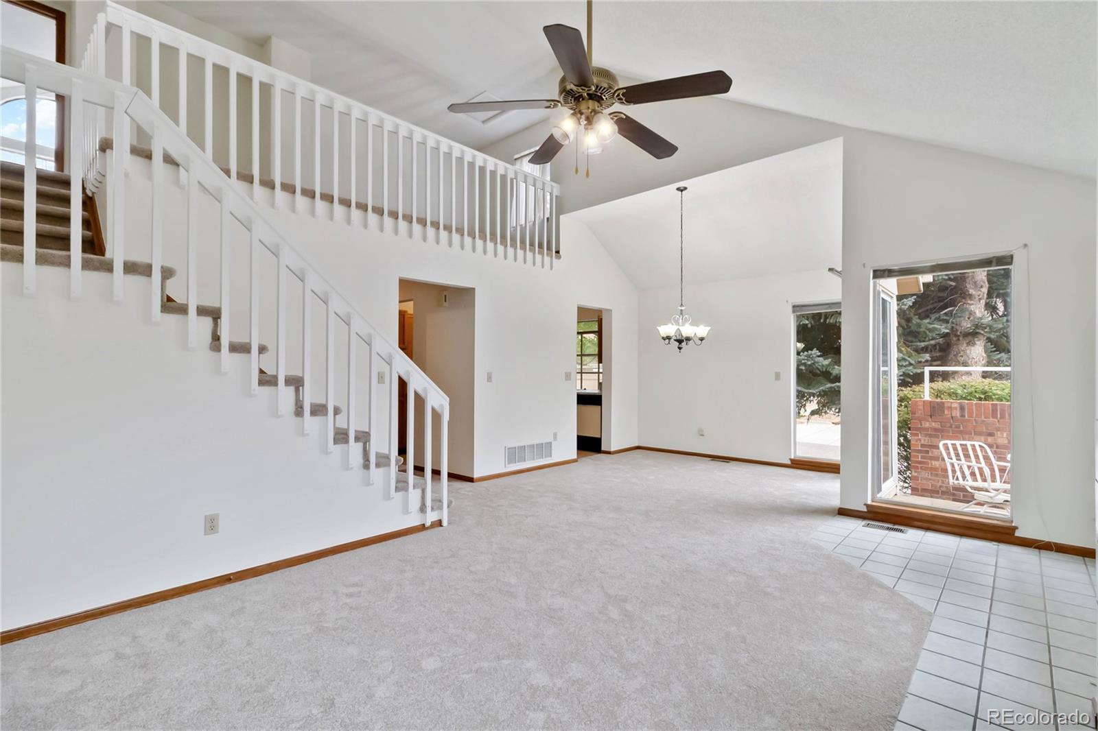 2136 South Scranton Way Aurora, CO 80014 - Photo 2 of 22 wooden floor in an empty room with a window