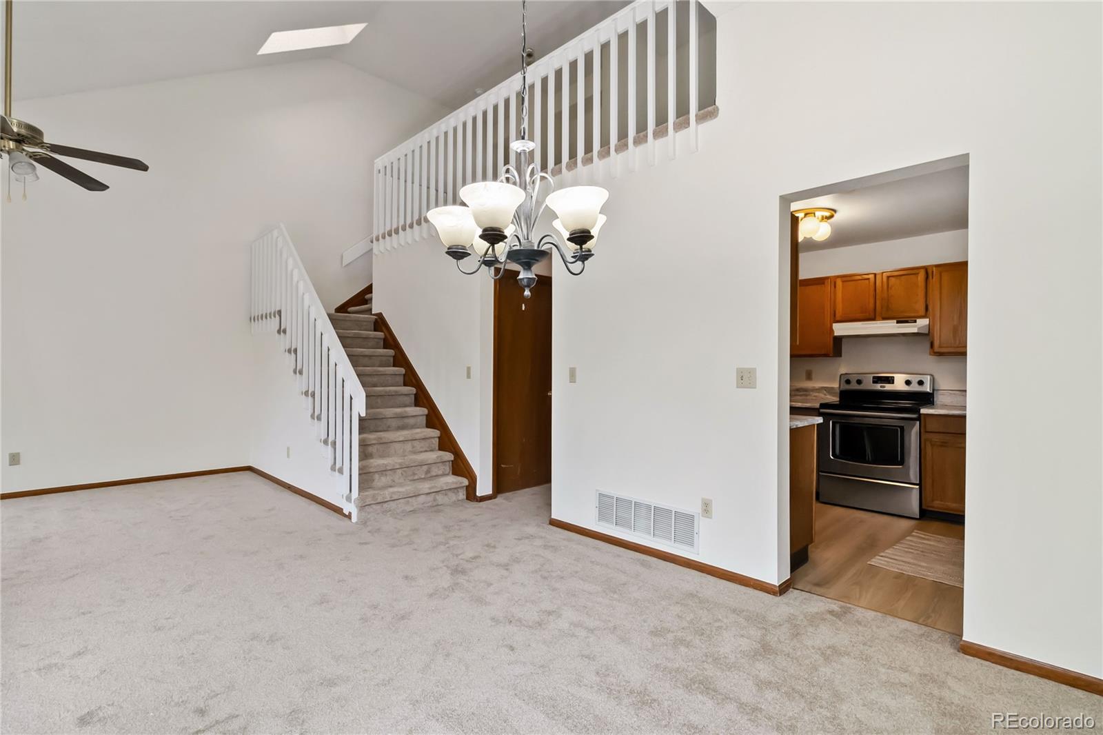 2136 South Scranton Way Aurora, CO 80014 - Photo 4 of 22 a view of a hallway with entryway and front door