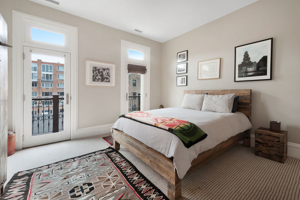 643 West Deming Place Chicago, IL 60614 - Photo 32 of 44 a bedroom with a large bed and a window