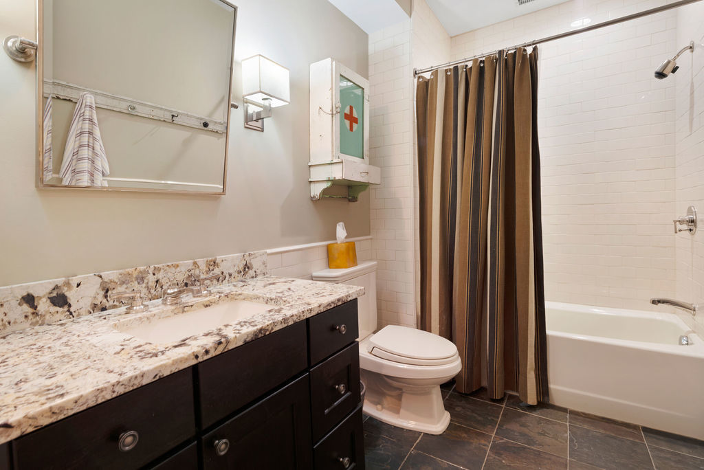 643 West Deming Place Chicago, IL 60614 - Photo 35 of 44 a bathroom with a granite countertop sink toilet and shower