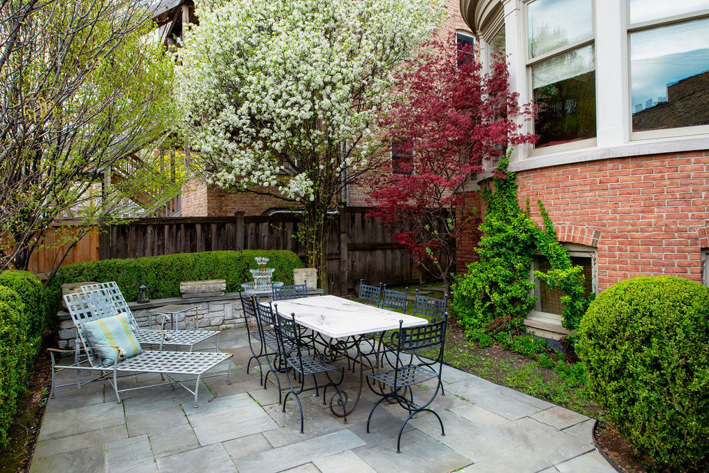 643 West Deming Place Chicago, IL 60614 - Photo 41 of 44 a view of a patio with a table and chairs and a fire pit