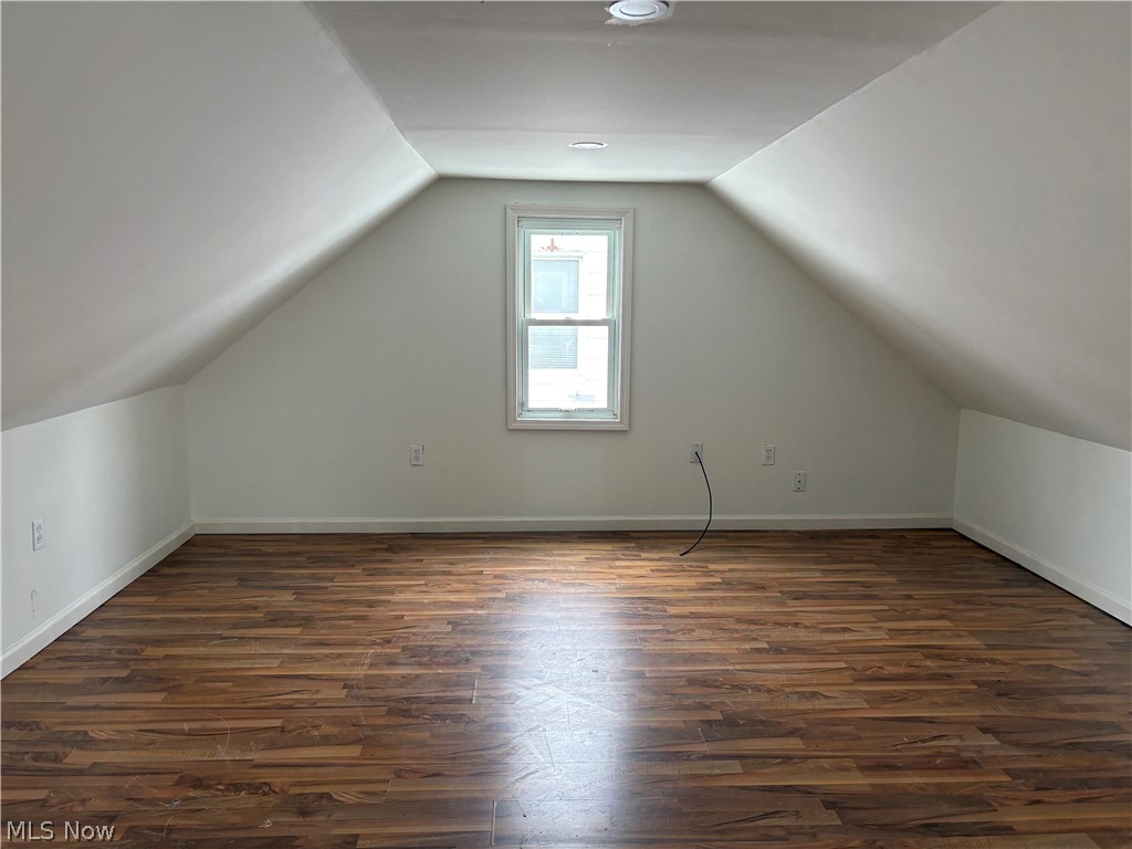 15521 Corkhill Road Maple Heights, OH 44137 - Photo 14 of 33 Bonus room with dark wood-type flooring and baseboards