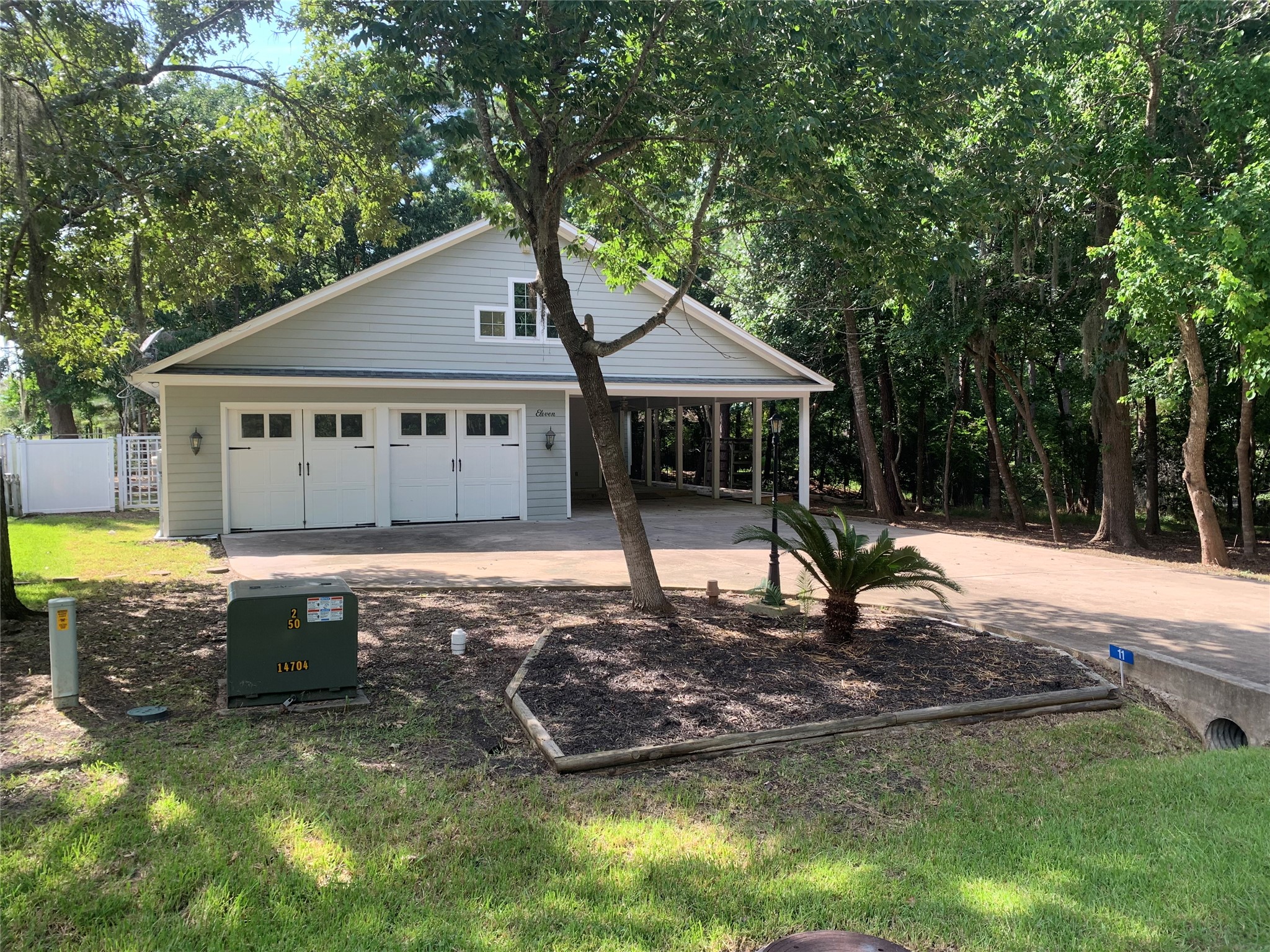 11 Lords Circle Coldspring, TX 77331 - Photo 2 of 27 Another front view of large trees surrounding the home