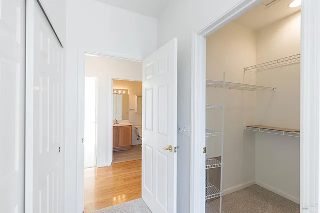 a bathroom with a sink vanity granite and toilet