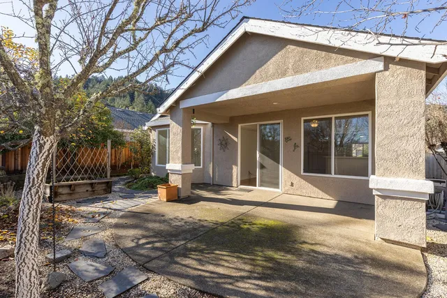 a view of a house with a small yard