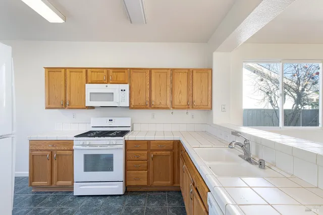 a view of a kitchen cabinets and window