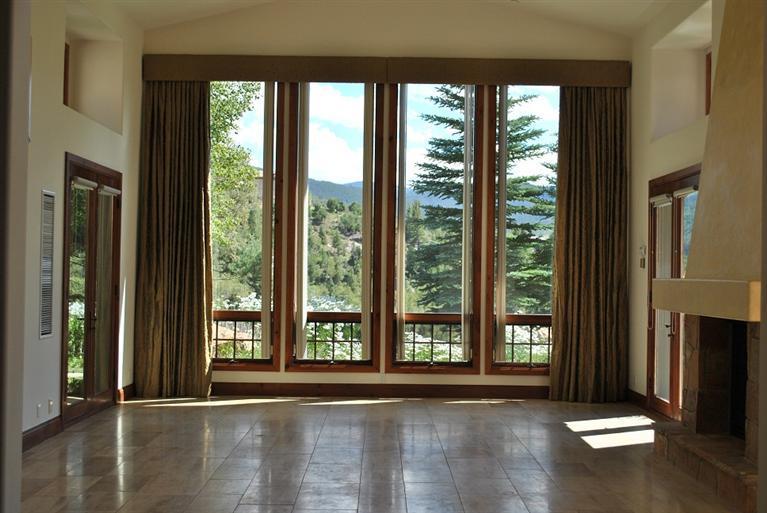 350 Little Andorra Road Edwards, CO 81632 - Photo 11 of 11 a view of an empty room with wooden floor and a window