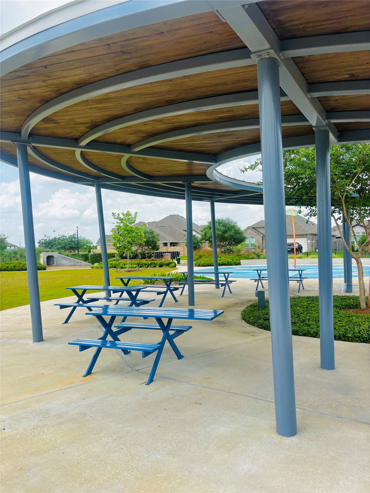 2126 Mosaic Vly Court Angleton, TX 77515 - Photo 40 of 40 a view of a swimming pool with a table and chairs in the porch