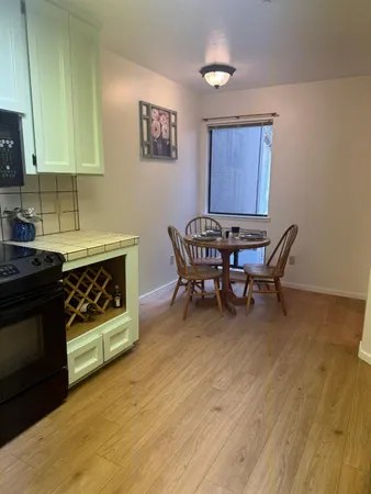 a view of an entryway with wooden floor