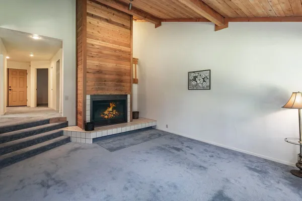 a view of an empty room with a window