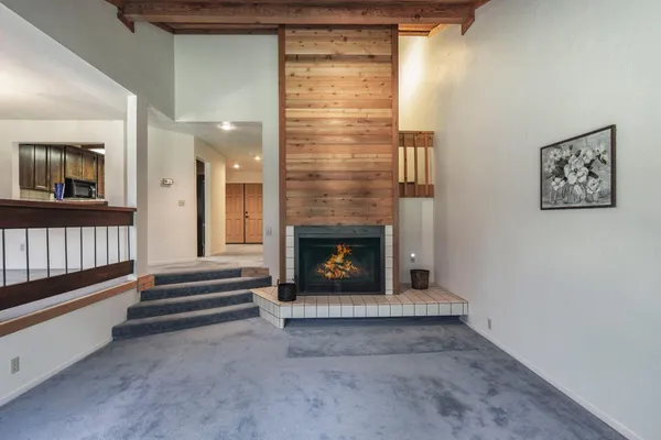 a view of a living room with a large window