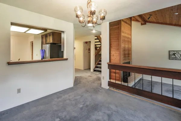 a bedroom with a bed and a lamp on table