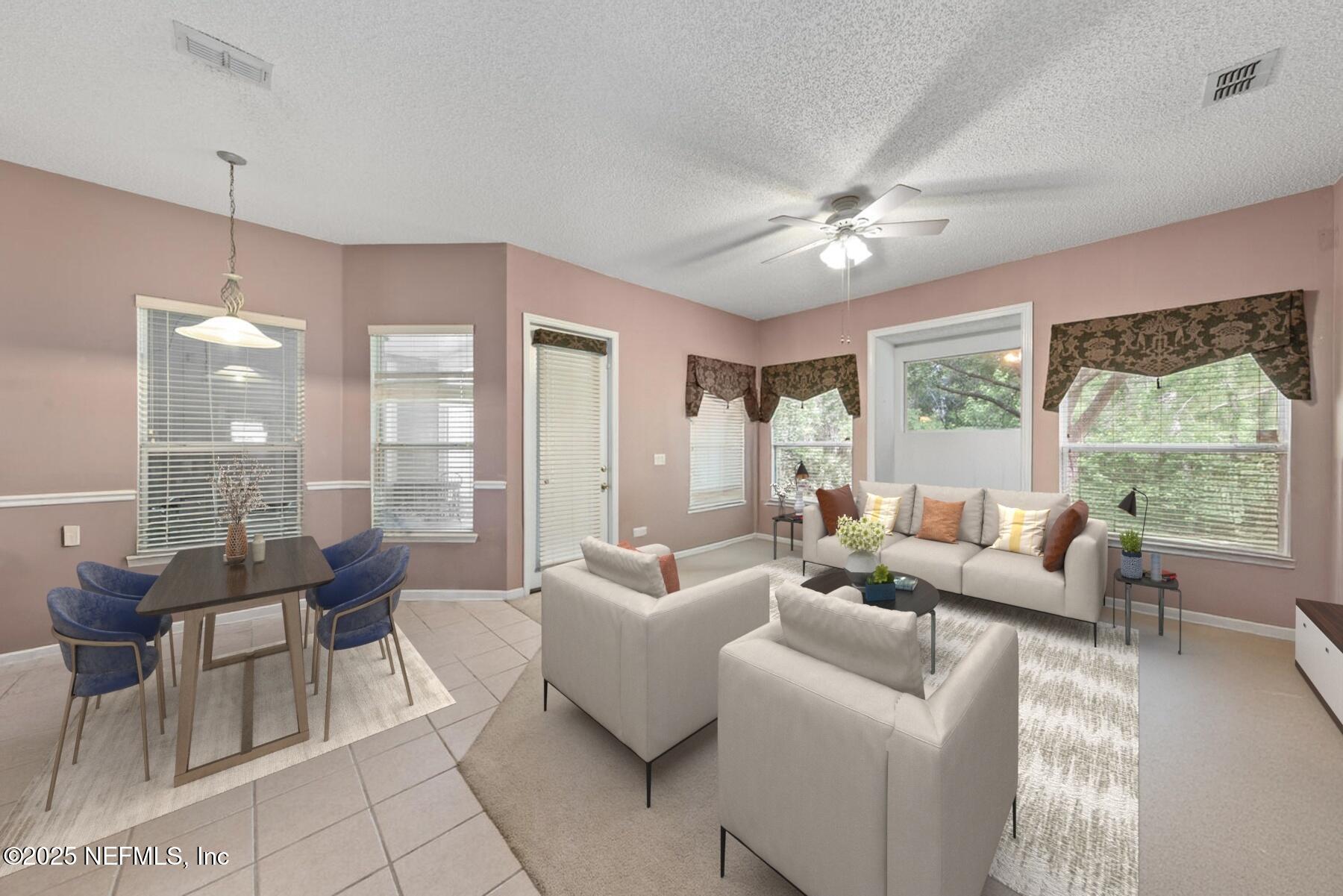 4219 Woodley Creek Road Jacksonville, FL 32218 - Photo 11 of 28 a living room with furniture and a large window