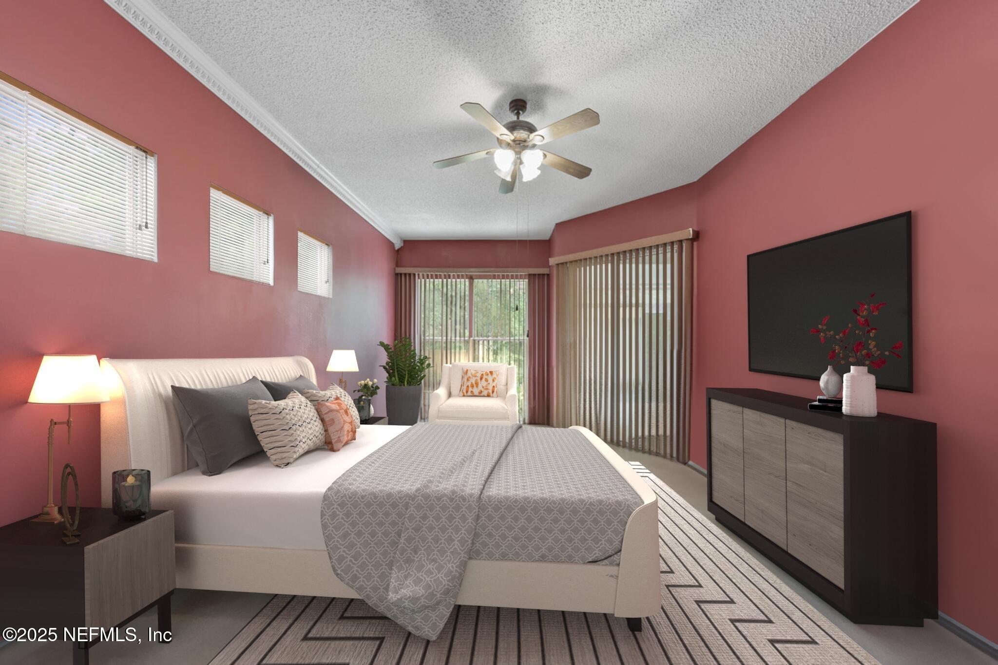 4219 Woodley Creek Road Jacksonville, FL 32218 - Photo 13 of 28 a bedroom with a large bed and a chandelier
