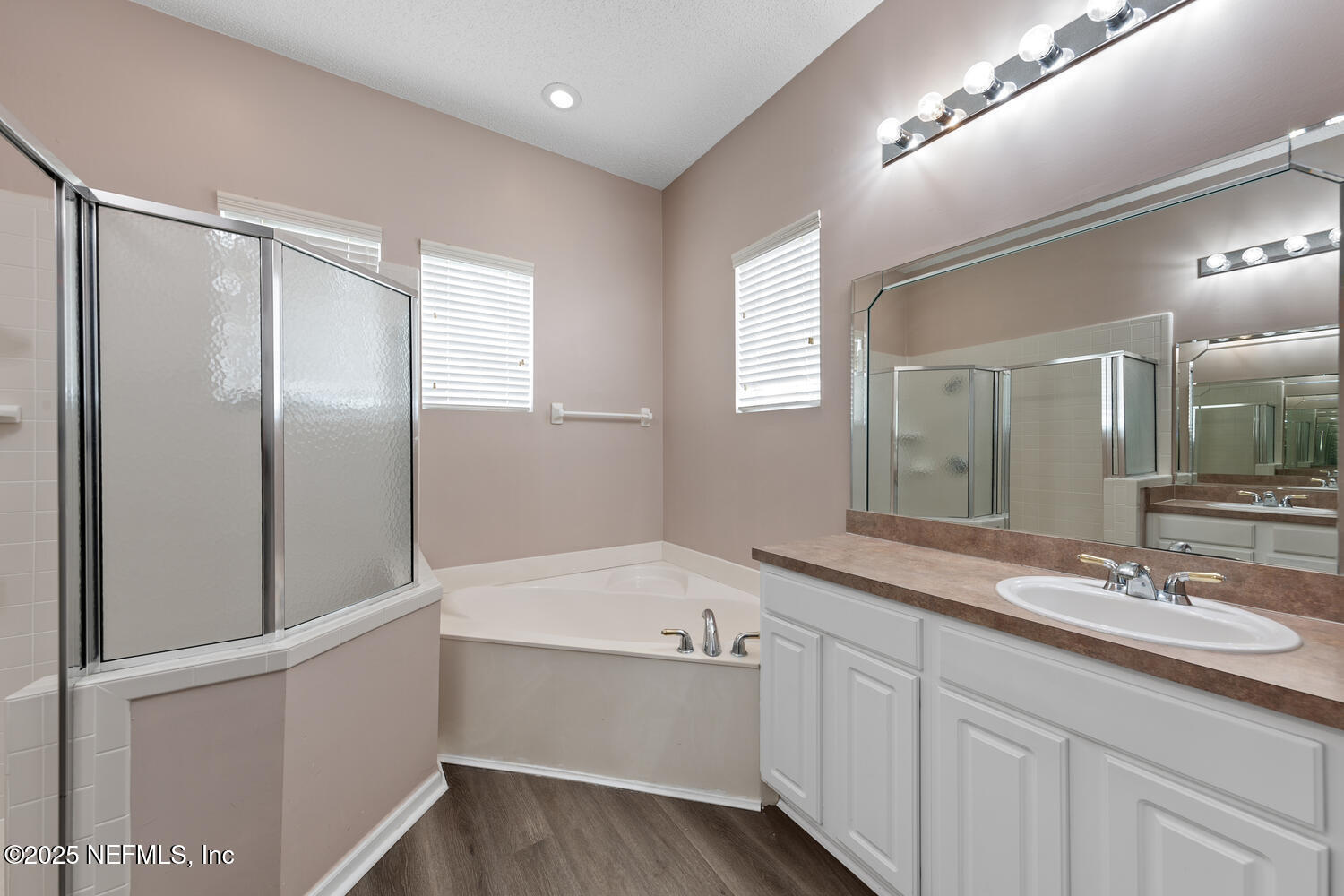 4219 Woodley Creek Road Jacksonville, FL 32218 - Photo 14 of 28 a bathroom with a bathtub and a sink