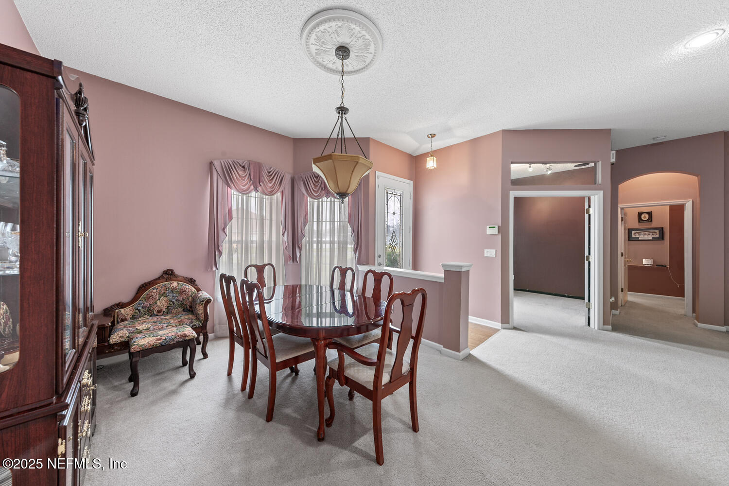 4219 Woodley Creek Road Jacksonville, FL 32218 - Photo 2 of 28 a view of a dining room with furniture and window