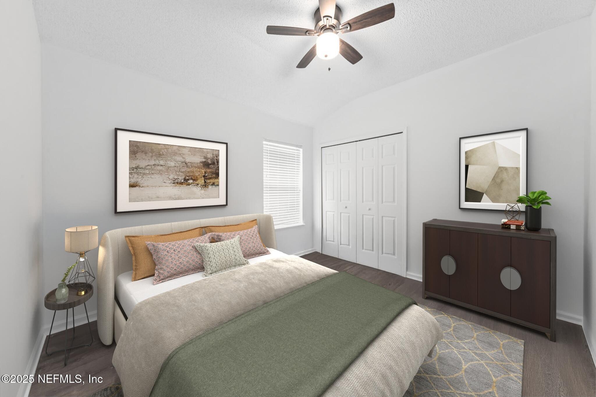 4219 Woodley Creek Road Jacksonville, FL 32218 - Photo 21 of 28 a bedroom with a bed and a painting on the wall