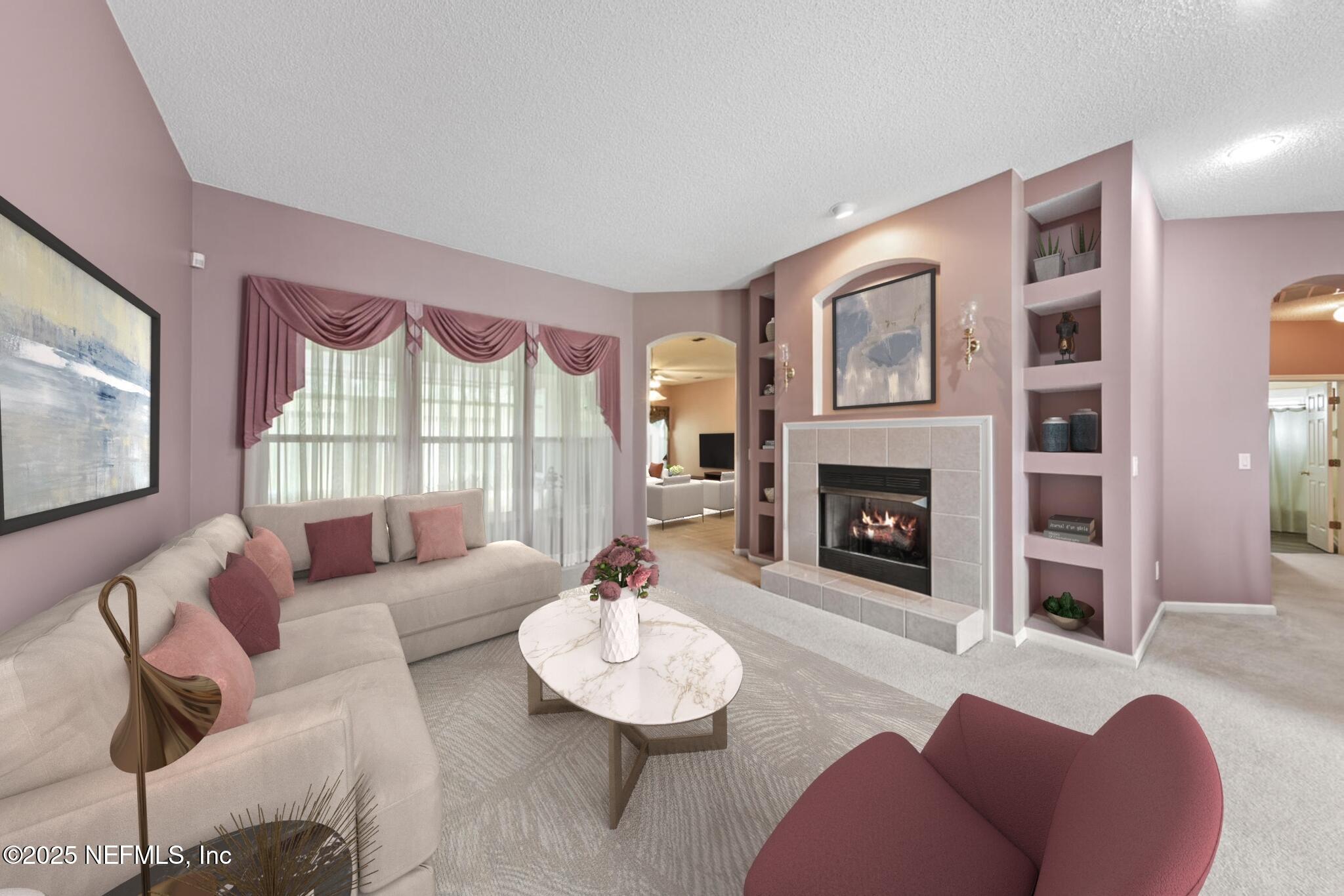 4219 Woodley Creek Road Jacksonville, FL 32218 - Photo 3 of 28 a living room with furniture a fireplace and a flat screen tv