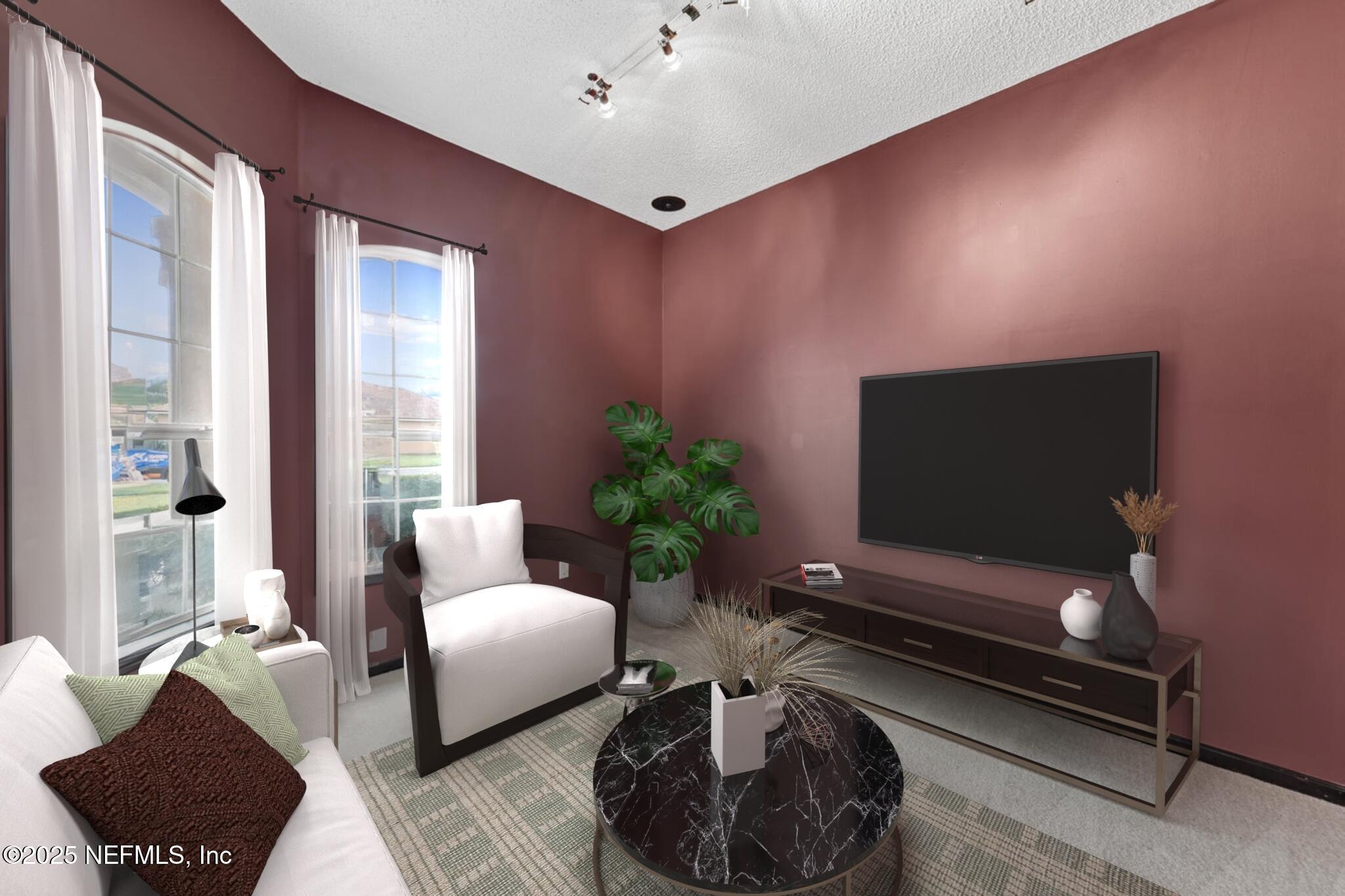 4219 Woodley Creek Road Jacksonville, FL 32218 - Photo 6 of 28 a living room with furniture and a flat screen tv