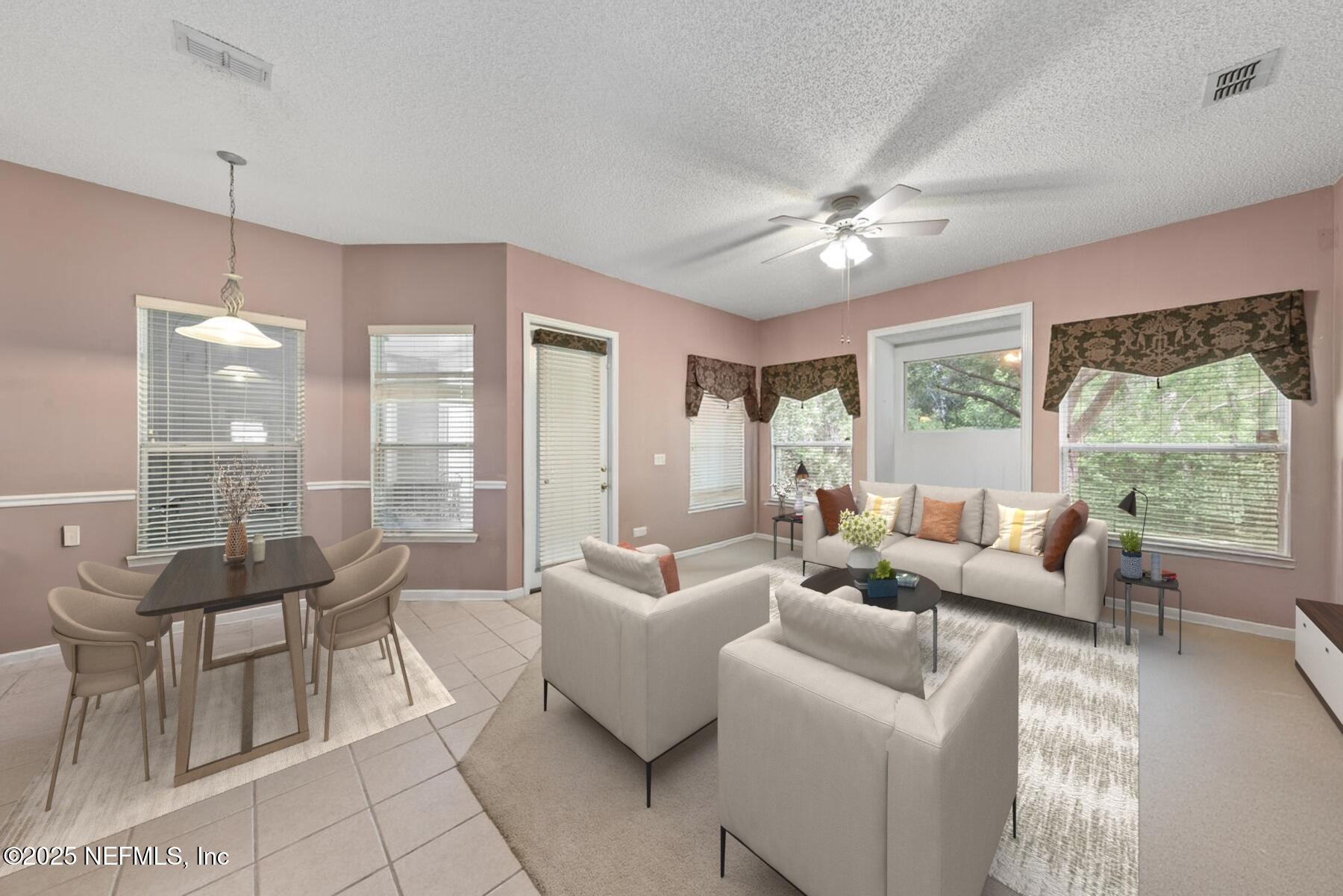 4219 Woodley Creek Road Jacksonville, FL 32218 - Photo 10 of 28 a living room with furniture and a large window