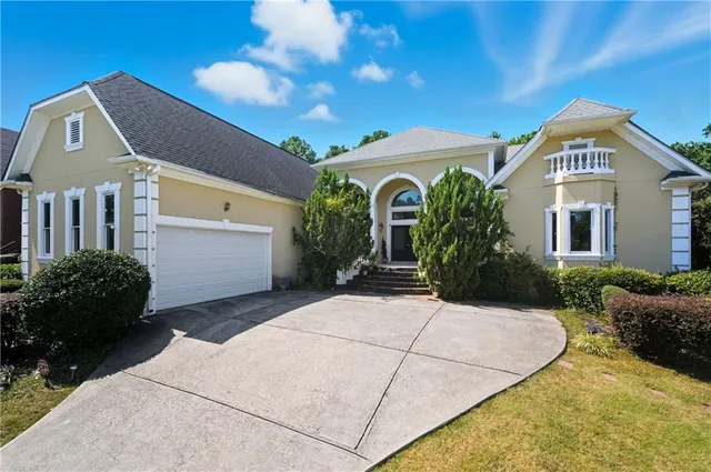 a front view of a house with garden