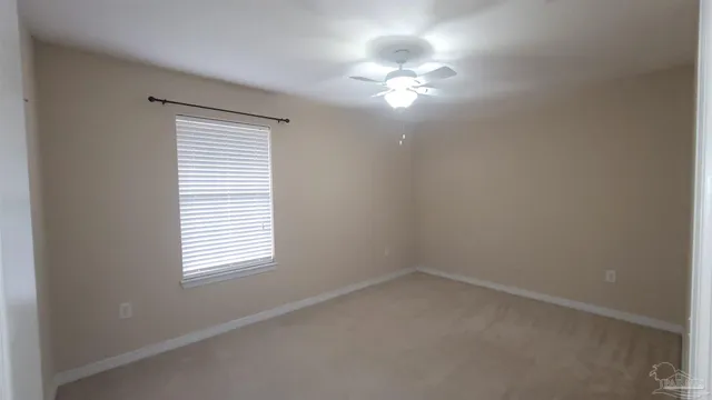 a bathroom with a granite countertop sink toilet a mirror and shower