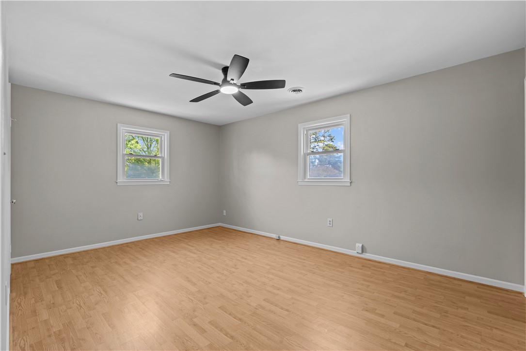 101 Maria Lane Seneca, SC 29678 - Photo 14 of 31 This airy bedroom features abundant natural light and warm hardwood flooring.