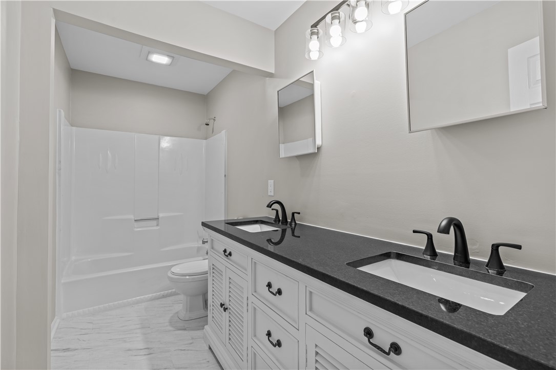 101 Maria Lane Seneca, SC 29678 - Photo 15 of 31 This sleek bathroom features a double vanity and spacious shower, offering both comfort and practicality.