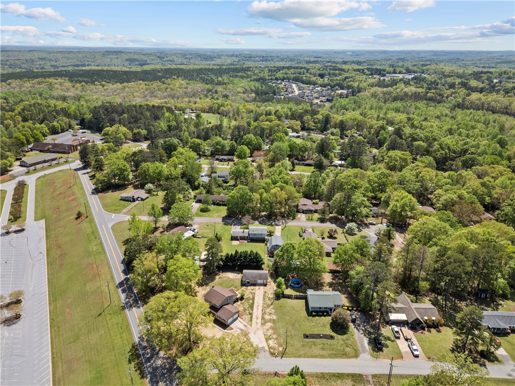 101 Maria Lane Seneca, SC 29678 - Photo 24 of 31 This elevated perspective showcases a peaceful neighborhood amidst verdant landscapes and open skies.