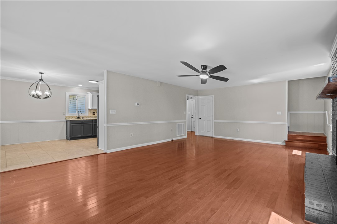 101 Maria Lane Seneca, SC 29678 - Photo 9 of 31 This living space offers an open concept, showcasing hardwood floors and a fireplace feature.