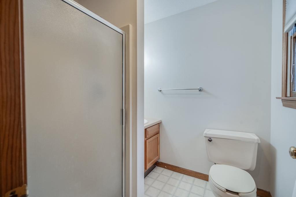 20 Middle Road Enfield, CT 06082 - Photo 17 of 29 a white toilet sitting next to a shower
