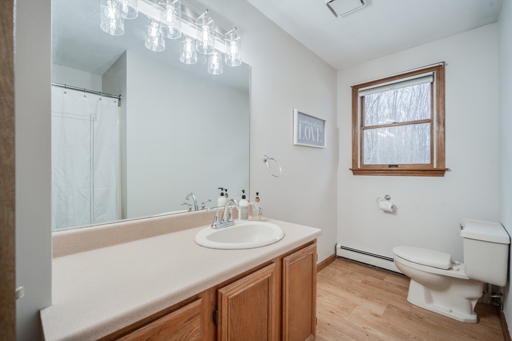 20 Middle Road Enfield, CT 06082 - Photo 20 of 29 a bathroom with a sink toilet and a mirror