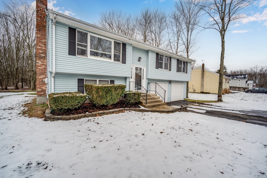 20 Middle Road Enfield, CT 06082 - Photo 2 of 29 a front view of a house with a yard