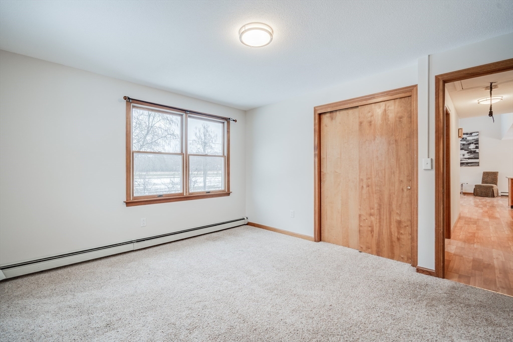 20 Middle Road Enfield, CT 06082 - Photo 23 of 29 an empty room with windows and closet