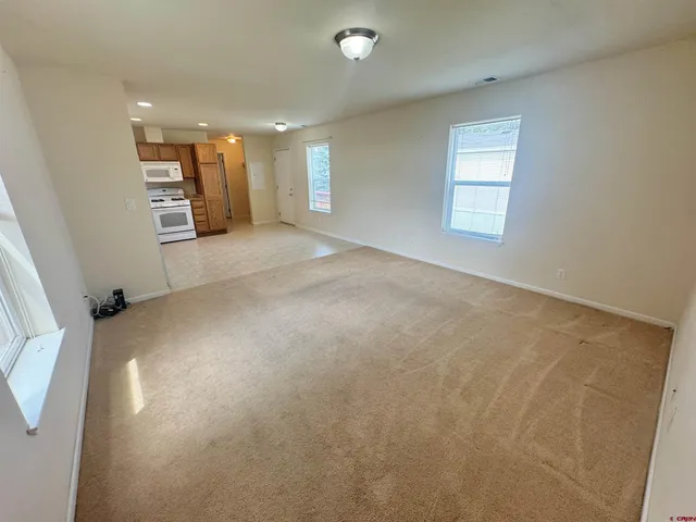 a view of an empty room with a window