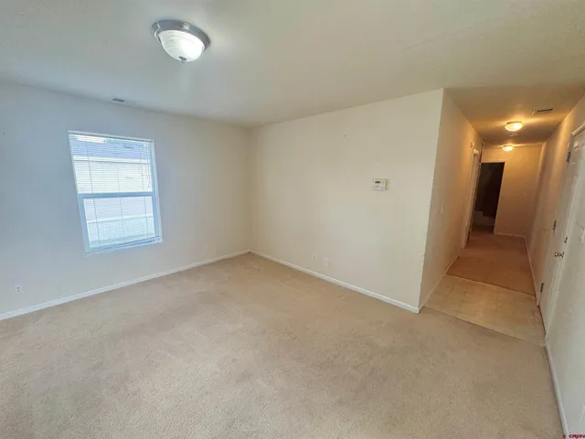 an empty room with a bathroom
