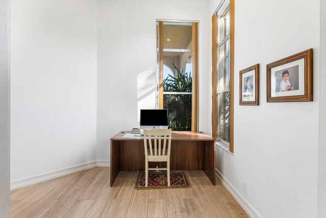 a workspace with furniture and a window