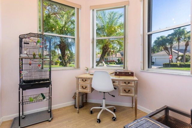 a work room with furniture and a window
