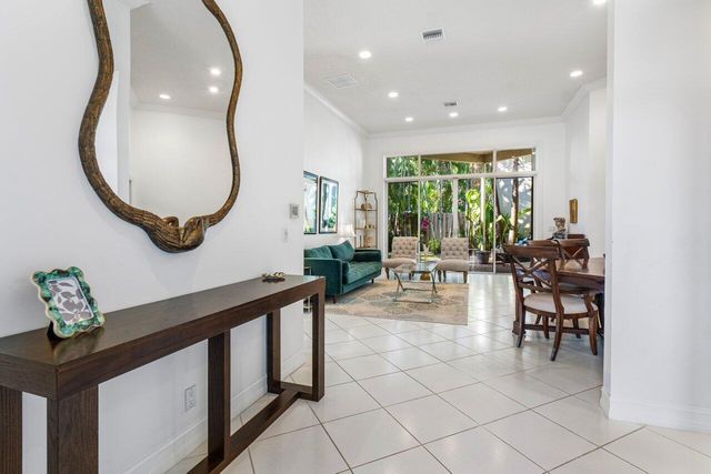 a lobby with furniture and a window