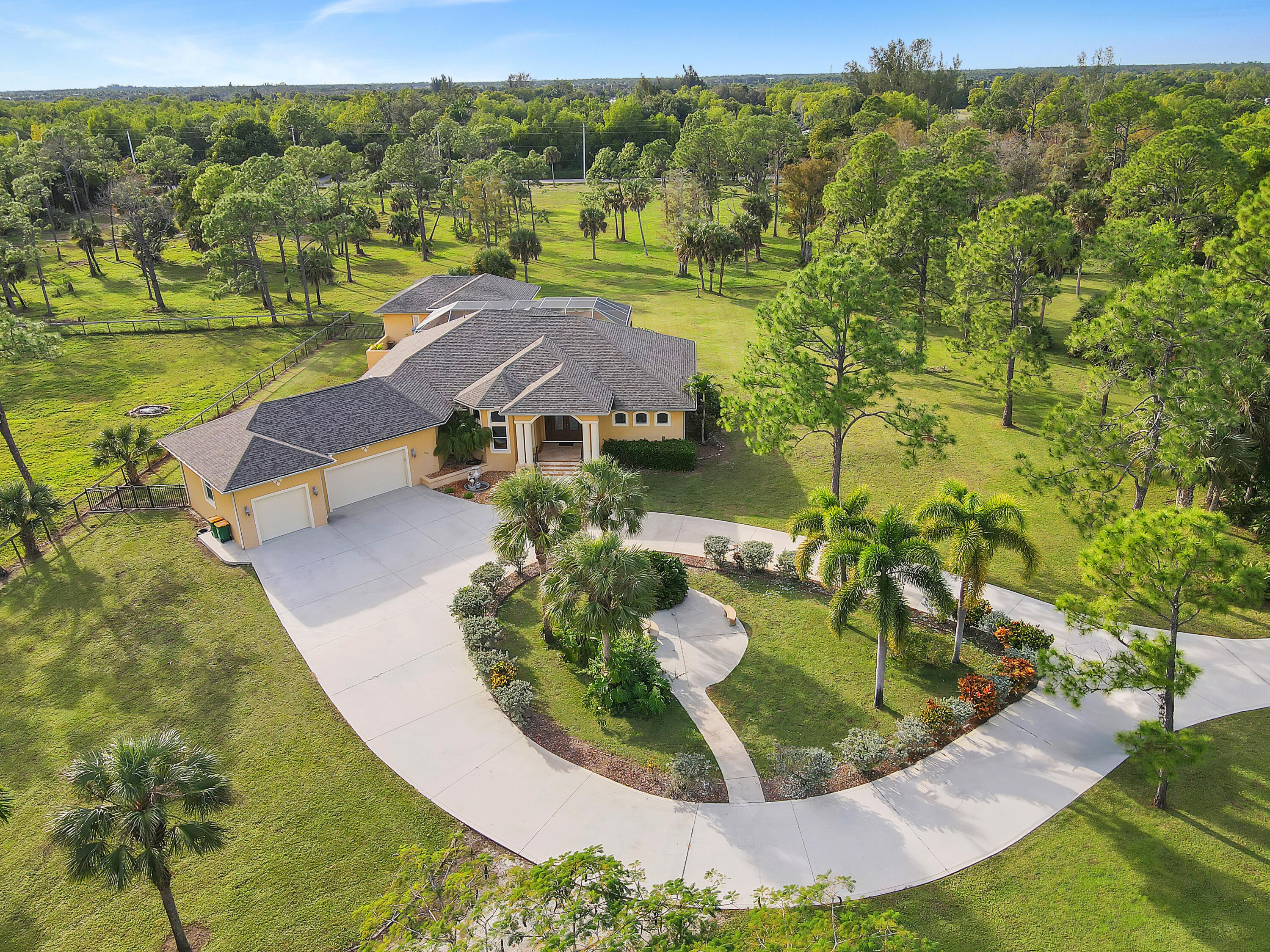 14600 Fritchey Road Naples, FL 34114 - Photo 1 of 44 an aerial view of residential houses with outdoor space and trees