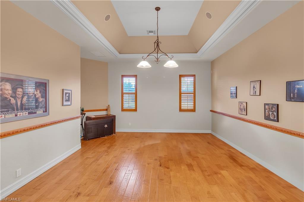 14600 Fritchey Road Naples, FL 34114 - Photo 18 of 44 a view of a bedroom with window and furniture