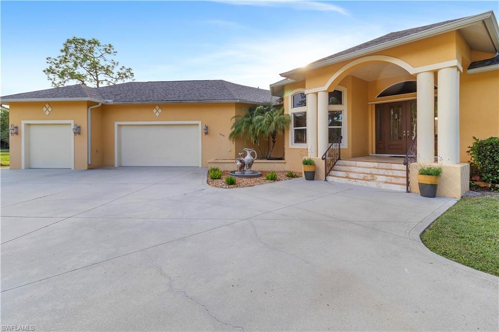 14600 Fritchey Road Naples, FL 34114 - Photo 2 of 44 a view of house with outdoor space and porch