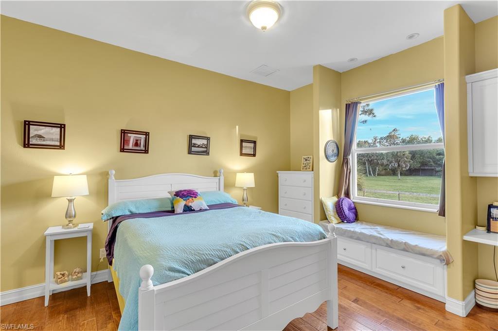 14600 Fritchey Road Naples, FL 34114 - Photo 21 of 44 a bedroom with a bed and a window