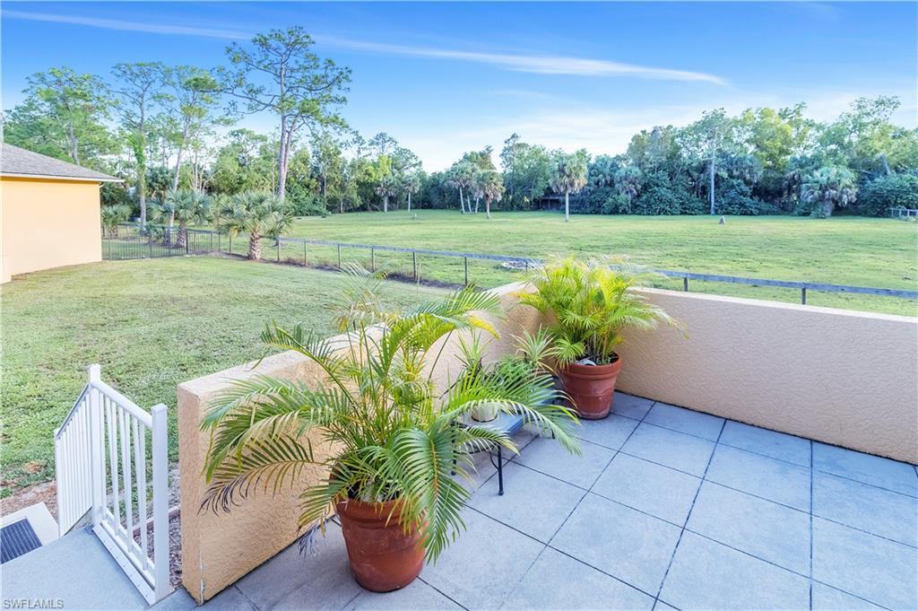 14600 Fritchey Road Naples, FL 34114 - Photo 27 of 44 a view of a garden with furniture