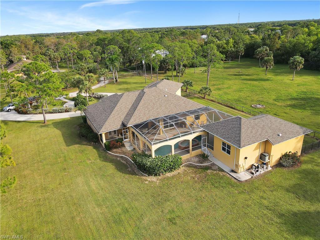 14600 Fritchey Road Naples, FL 34114 - Photo 30 of 44 swimming pool view with a lake view