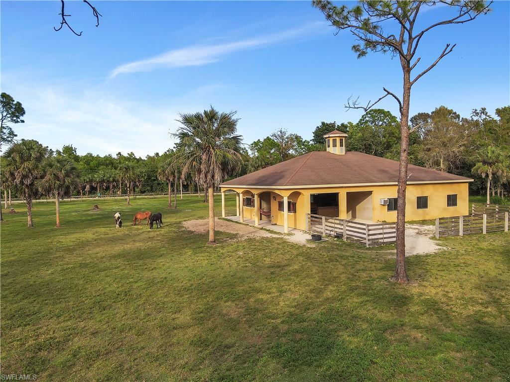 14600 Fritchey Road Naples, FL 34114 - Photo 35 of 44 a view of a house with a yard