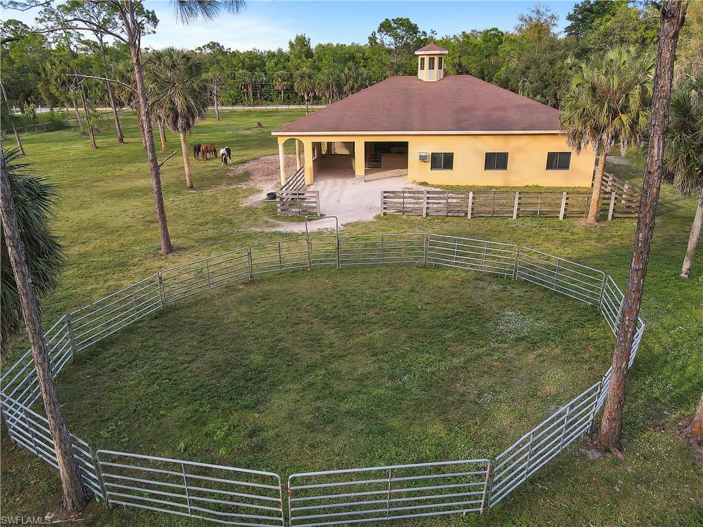 14600 Fritchey Road Naples, FL 34114 - Photo 36 of 44 a view of a house with a backyard